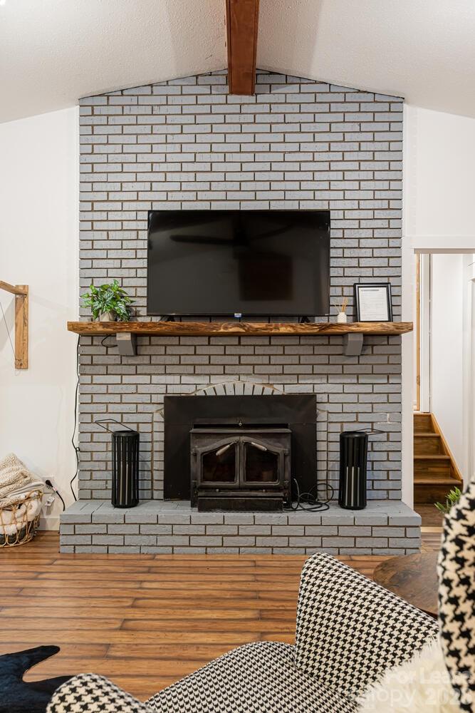 260 Allison Hill Road Brevard, NC 28712 - Photo 8 of 41 a living room with a fireplace and a fireplace