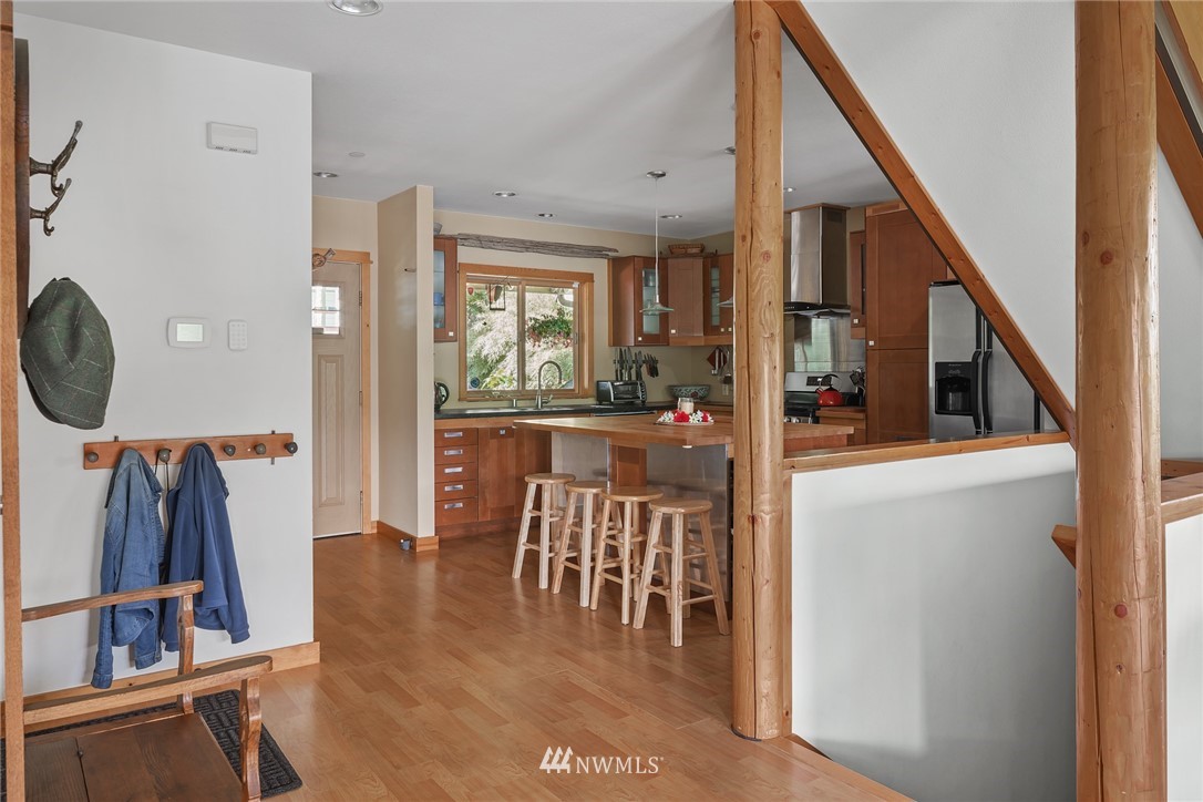 5909 Crescent Beach Road Northwest Vaughn, WA 98394 - Photo 12 of 35 a view of a dining room with furniture window and entryway