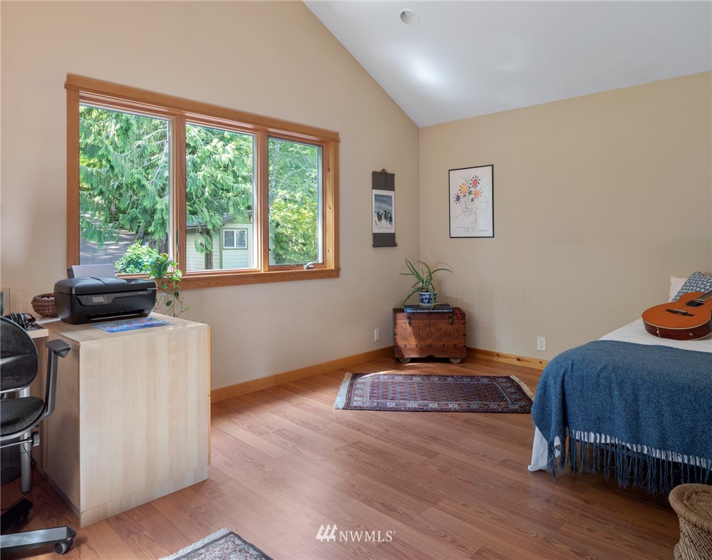 5909 Crescent Beach Road Northwest Vaughn, WA 98394 - Photo 19 of 35 a living room with furniture and a window