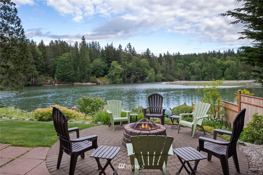 5909 Crescent Beach Road Northwest Vaughn, WA 98394 - Photo 3 of 35 a view of swimming pool with lawn chairs and a yard