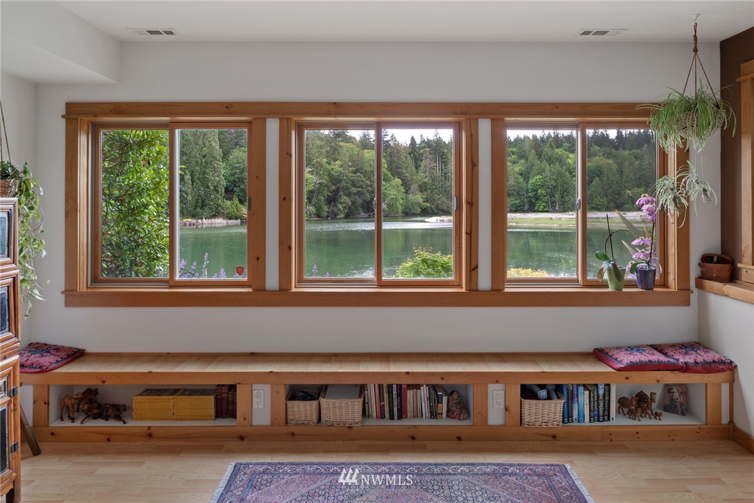 5909 Crescent Beach Road Northwest Vaughn, WA 98394 - Photo 23 of 35 a living room filled with furniture and a window