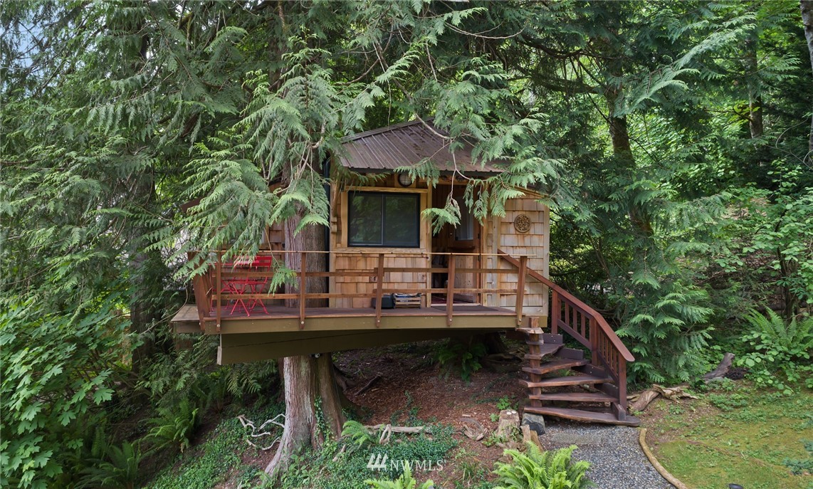 5909 Crescent Beach Road Northwest Vaughn, WA 98394 - Photo 28 of 35 a view of house with yard outdoor seating and green space