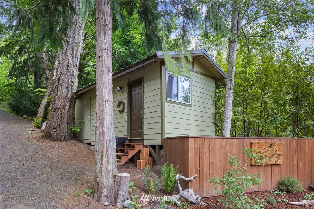 5909 Crescent Beach Road Northwest Vaughn, WA 98394 - Photo 33 of 35 a backyard of a house with lots of green space