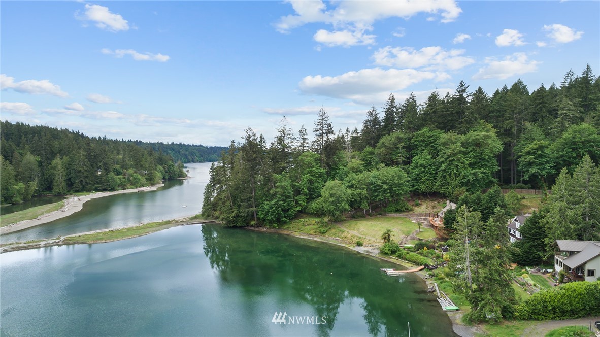 5909 Crescent Beach Road Northwest Vaughn, WA 98394 - Photo 5 of 35 a view of a lake in middle of forest