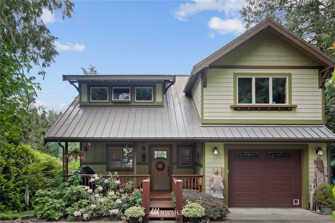 5909 Crescent Beach Road Northwest Vaughn, WA 98394 - Photo 9 of 35 a front view of a house