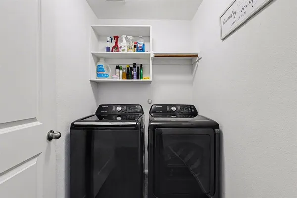 a kitchen with a stove and a refrigerator