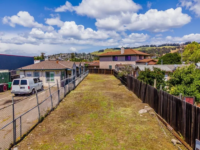 a view of a house with wooden deck