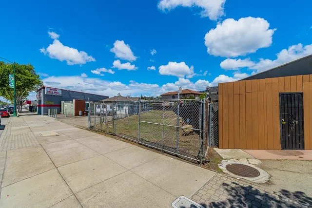 a swimming pool with wooden fence
