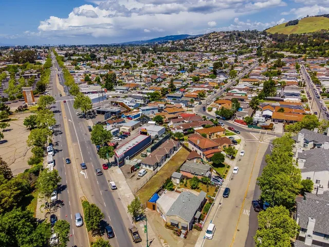 an aerial view of residential houses with outdoor space