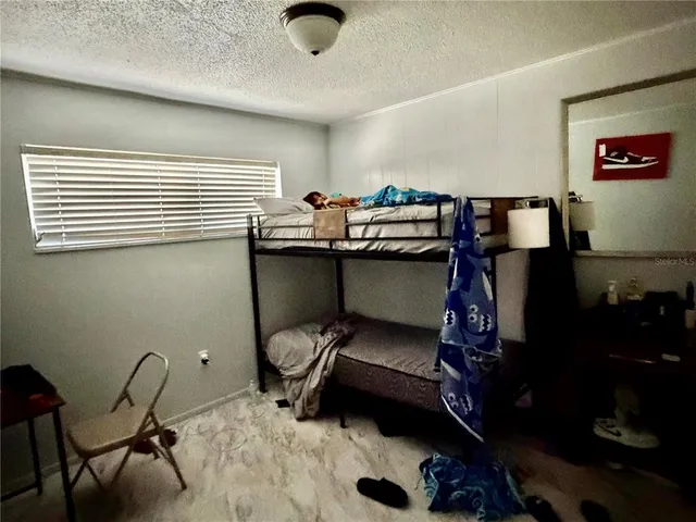 a bathroom with a bathtub sink and mirror