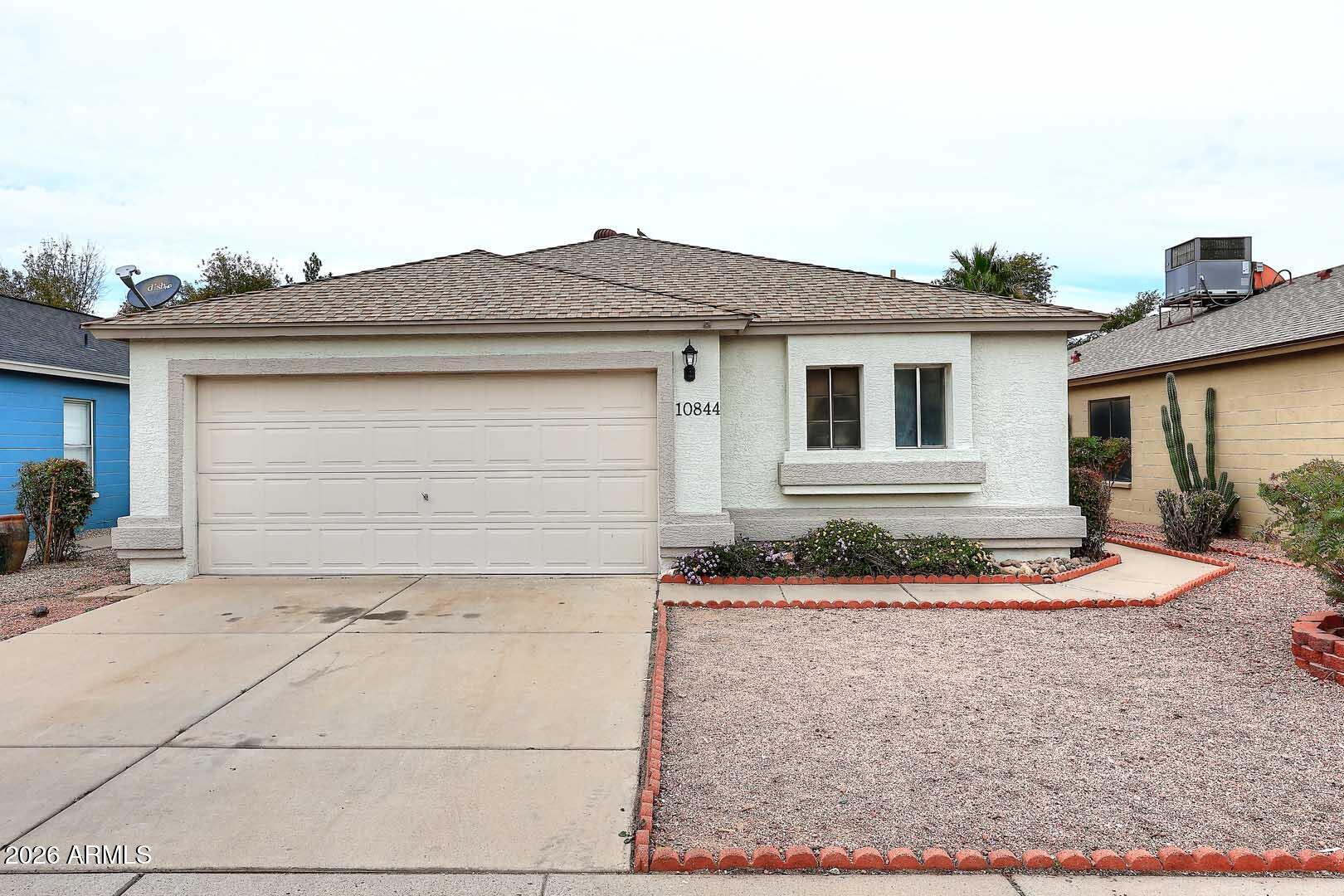 10844 West Ruth Avenue Peoria, AZ 85345 - Photo 2 of 33 a house view with a outdoor space