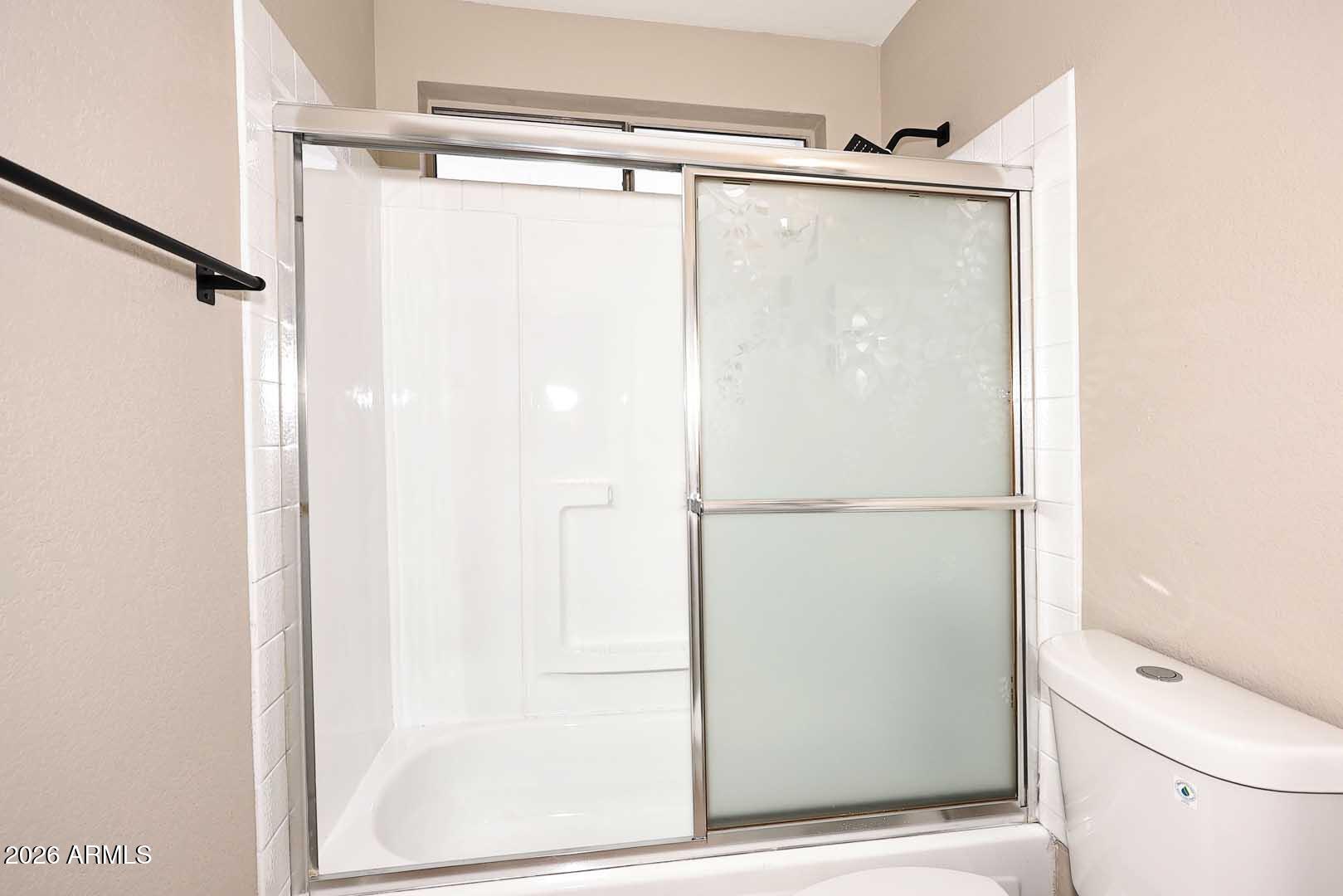 10844 West Ruth Avenue Peoria, AZ 85345 - Photo 22 of 33 a bathroom with a shower and a toilet