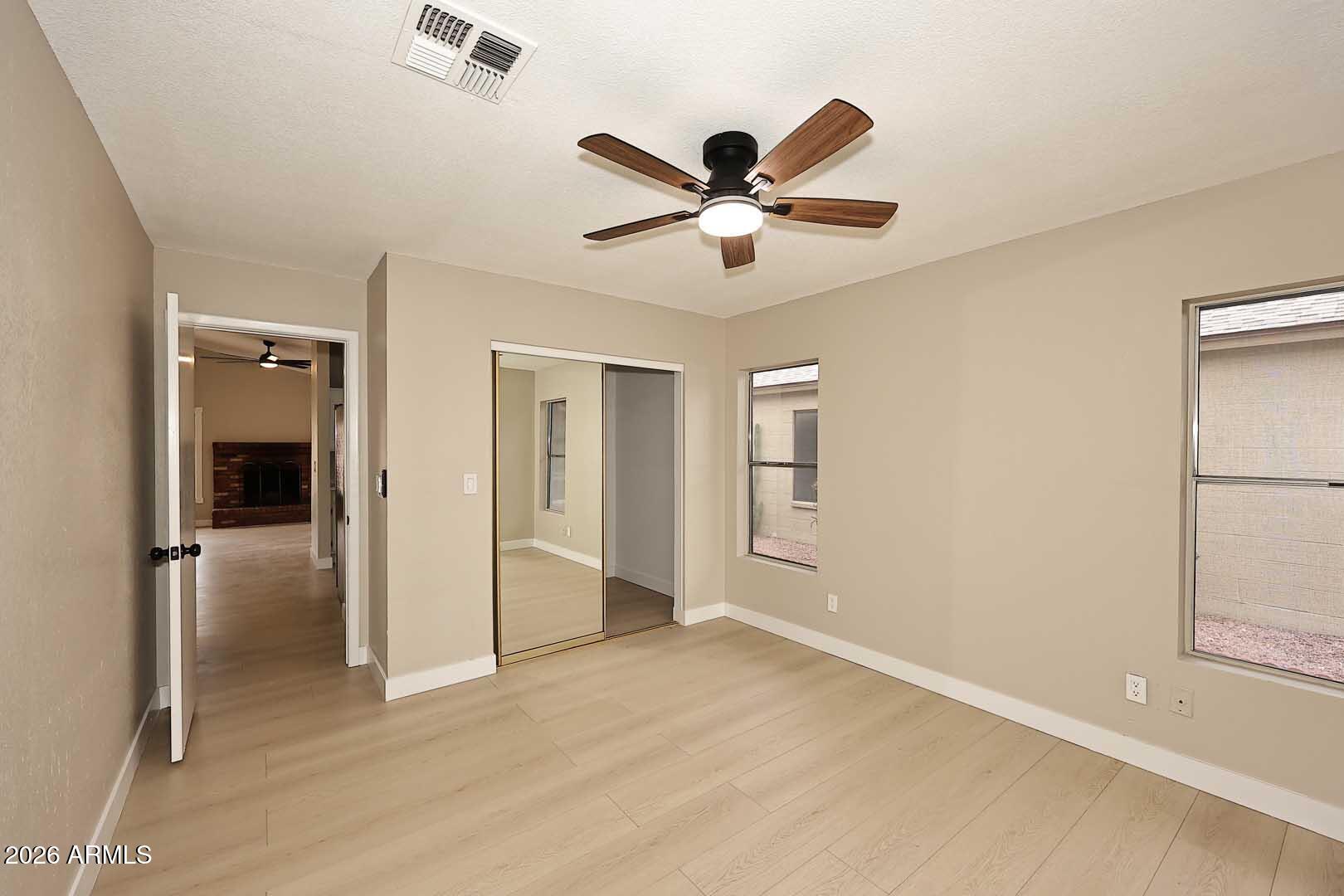 10844 West Ruth Avenue Peoria, AZ 85345 - Photo 24 of 33 a view of a livingroom with a ceiling fan and a window