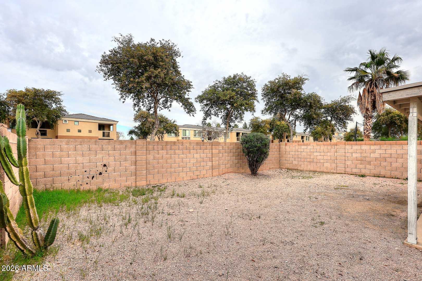 10844 West Ruth Avenue Peoria, AZ 85345 - Photo 32 of 33 a view of a yard with plants and trees