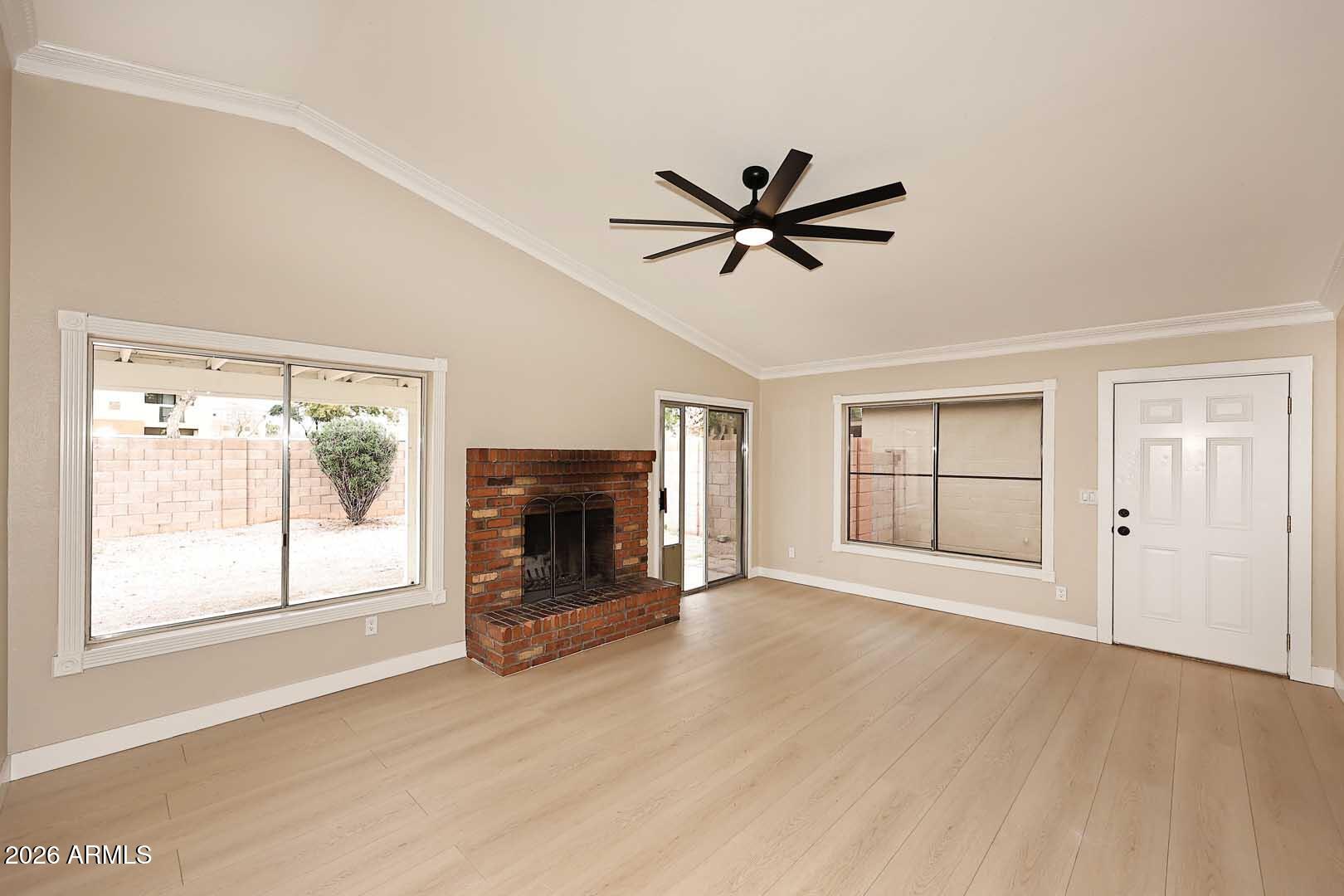 10844 West Ruth Avenue Peoria, AZ 85345 - Photo 7 of 33 a view of empty room with wooden floor and fan
