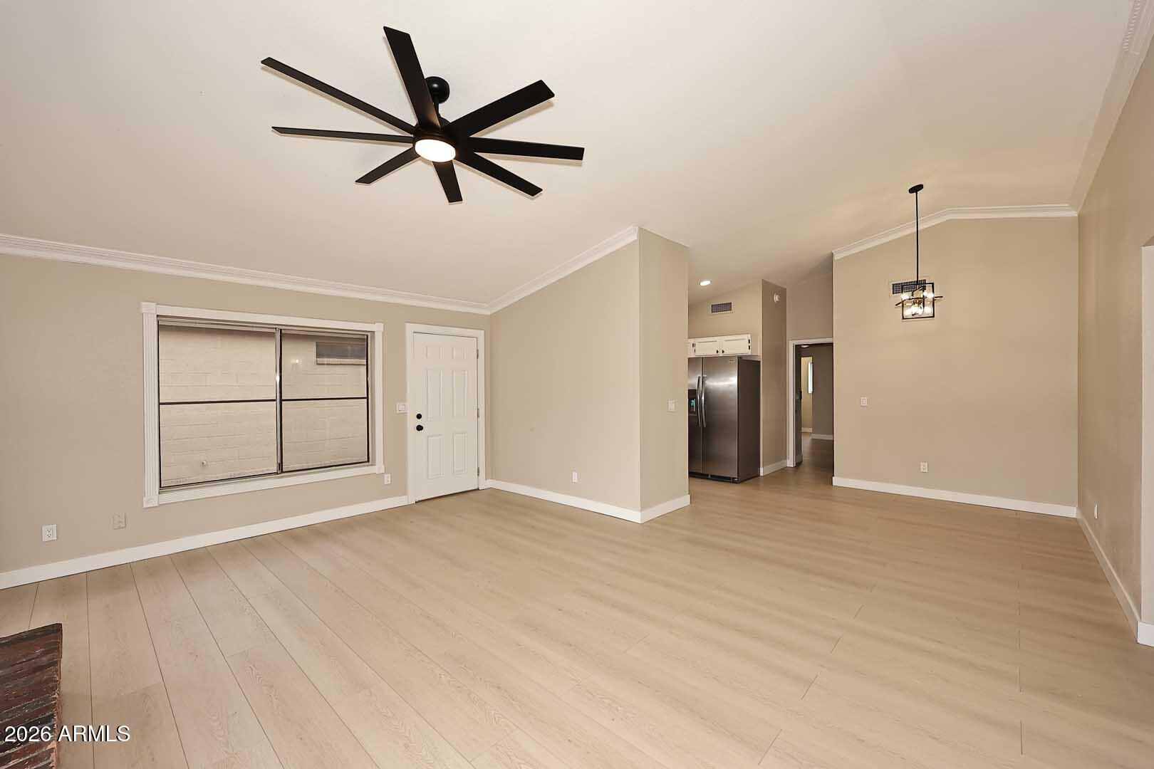 10844 West Ruth Avenue Peoria, AZ 85345 - Photo 8 of 33 wooden floor in an empty room with a window