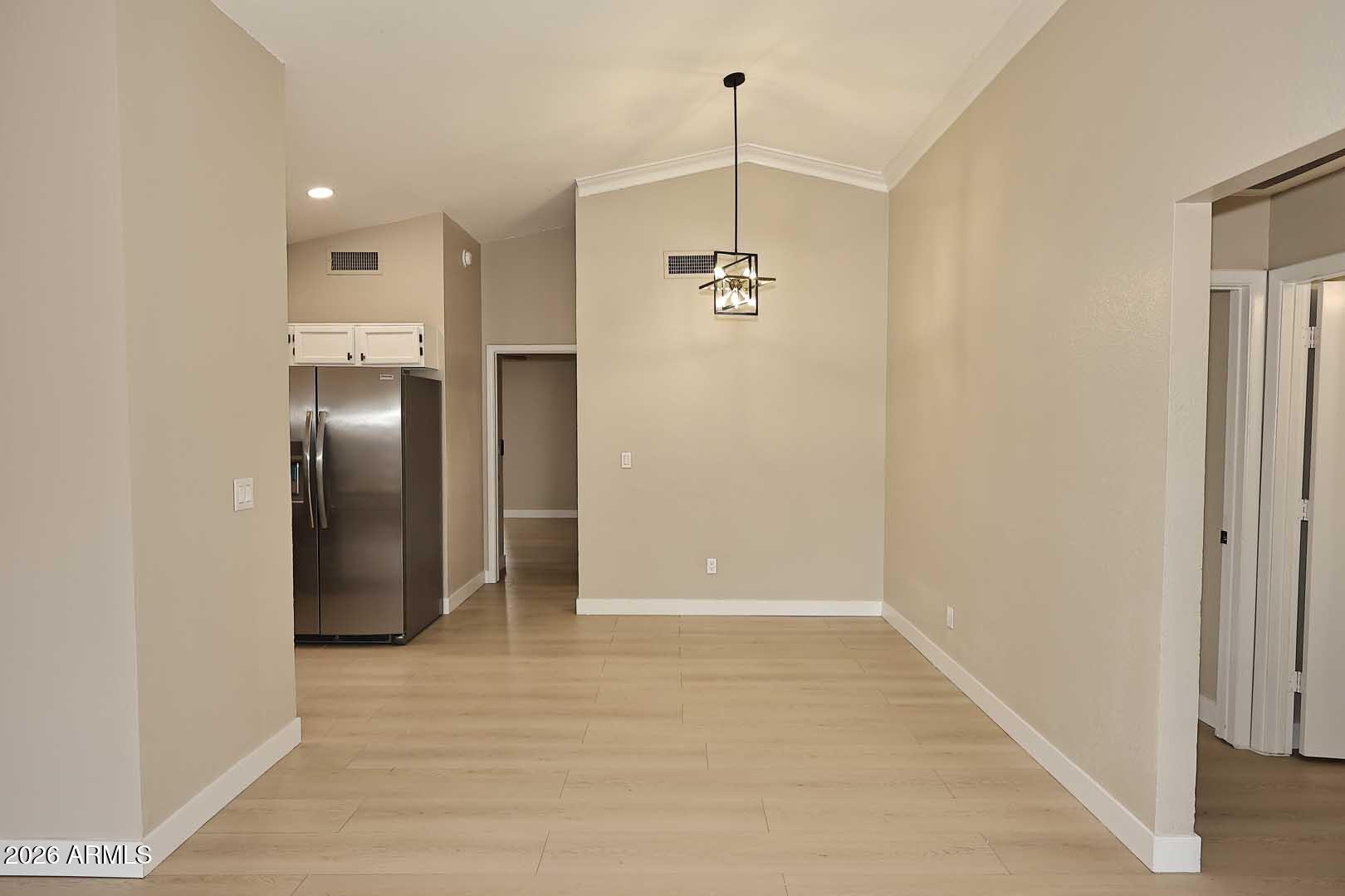 10844 West Ruth Avenue Peoria, AZ 85345 - Photo 9 of 33 a view of an empty room and kitchen view