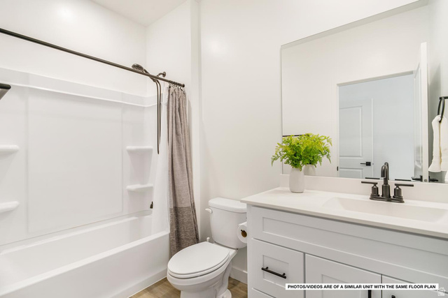 1702 Ripple Rock Drive, Unit 3171 Washington, UT 84780 - Photo 11 of 16 Bathroom featuring a white vanity with a light-toned countertop, a rectangular undermount sink, and matte black fixtures