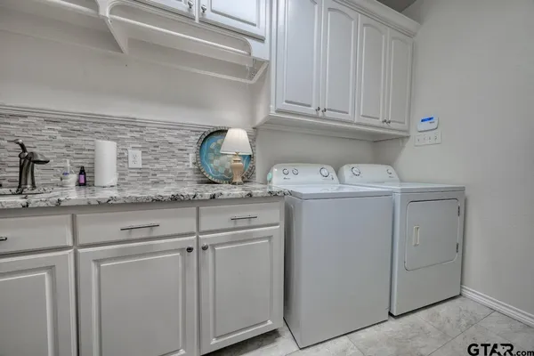 a view of a house with pool and sitting area