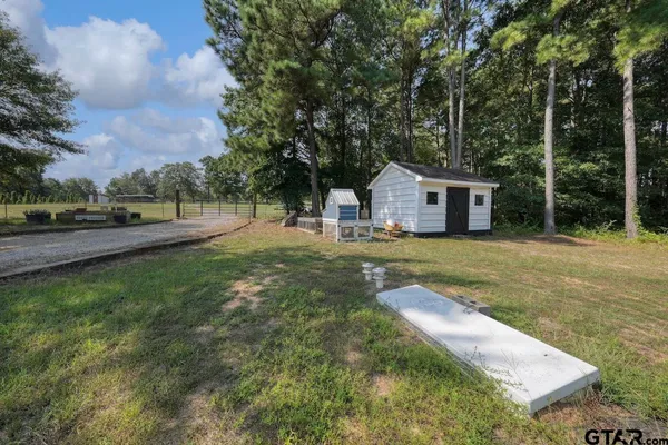 a spacious bathroom with a double vanity sink mirror and shower