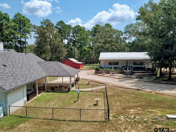 a view of a garage with a bike and car