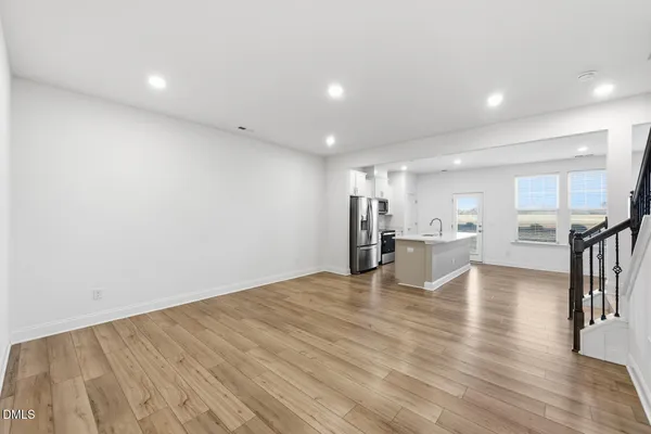 a view of a hallway with wooden shelves
