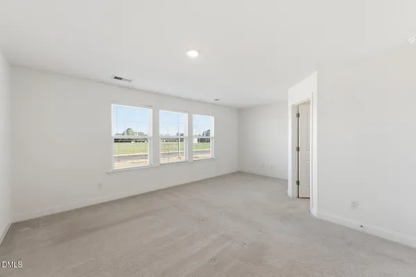 a bathroom with a double vanity sink mirror and shower