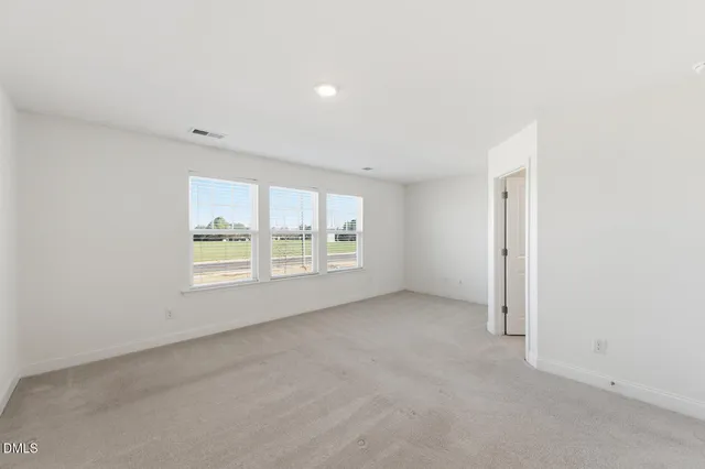 a bathroom with a double vanity sink mirror and shower