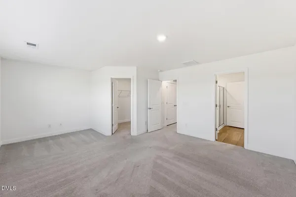 a bathroom with a double vanity sink toilet and a mirror