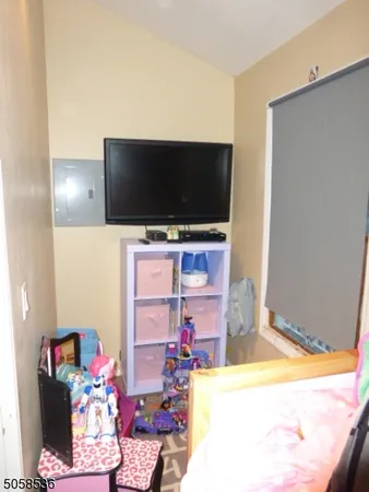 a living room with a flat screen tv and a couch