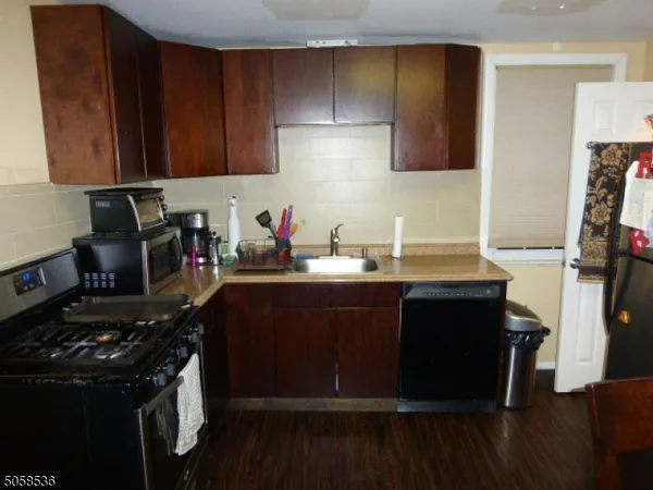 a kitchen with a sink and a stove