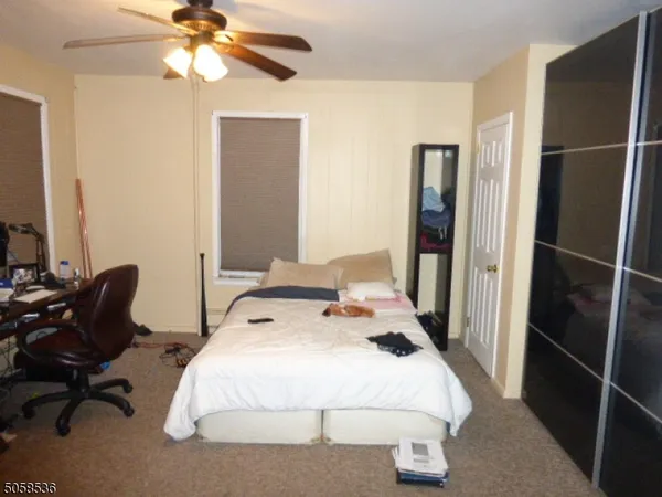 a bedroom with a bed and furniture