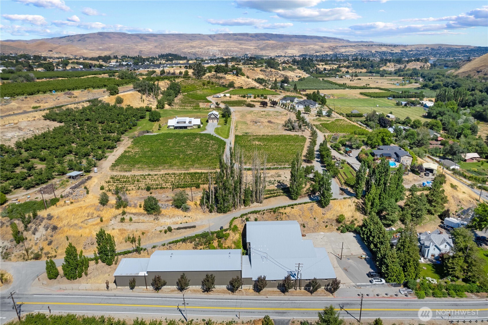 1260 Lower Sunnyslope Road Wenatchee, WA 98801 - Photo 22 of 24 an aerial view of residential houses with outdoor space