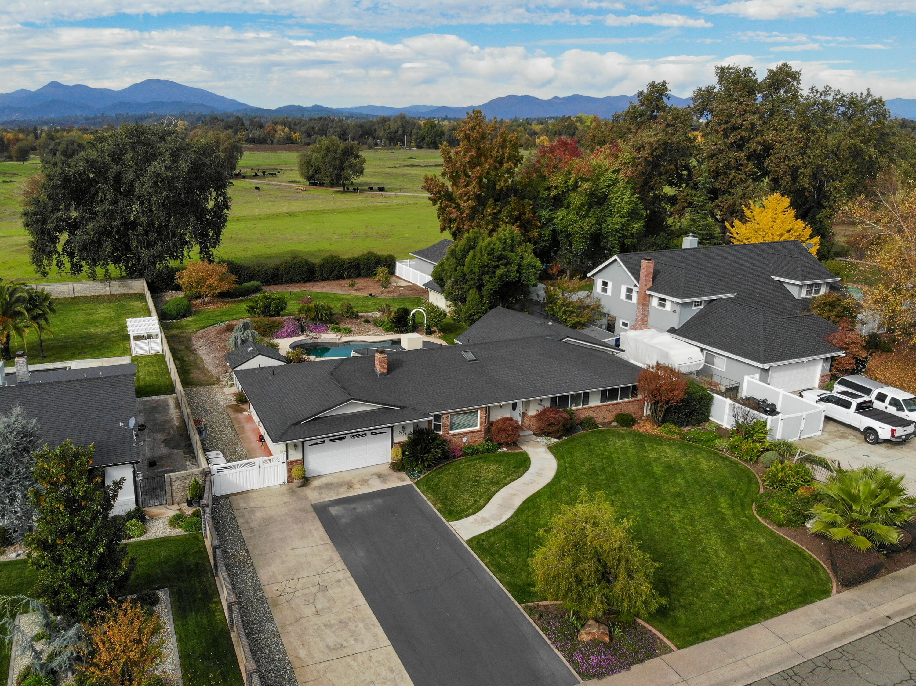 5956 Riverside Drive Redding, CA 96001 - Photo 1 of 54 an aerial view of a house with a garden
