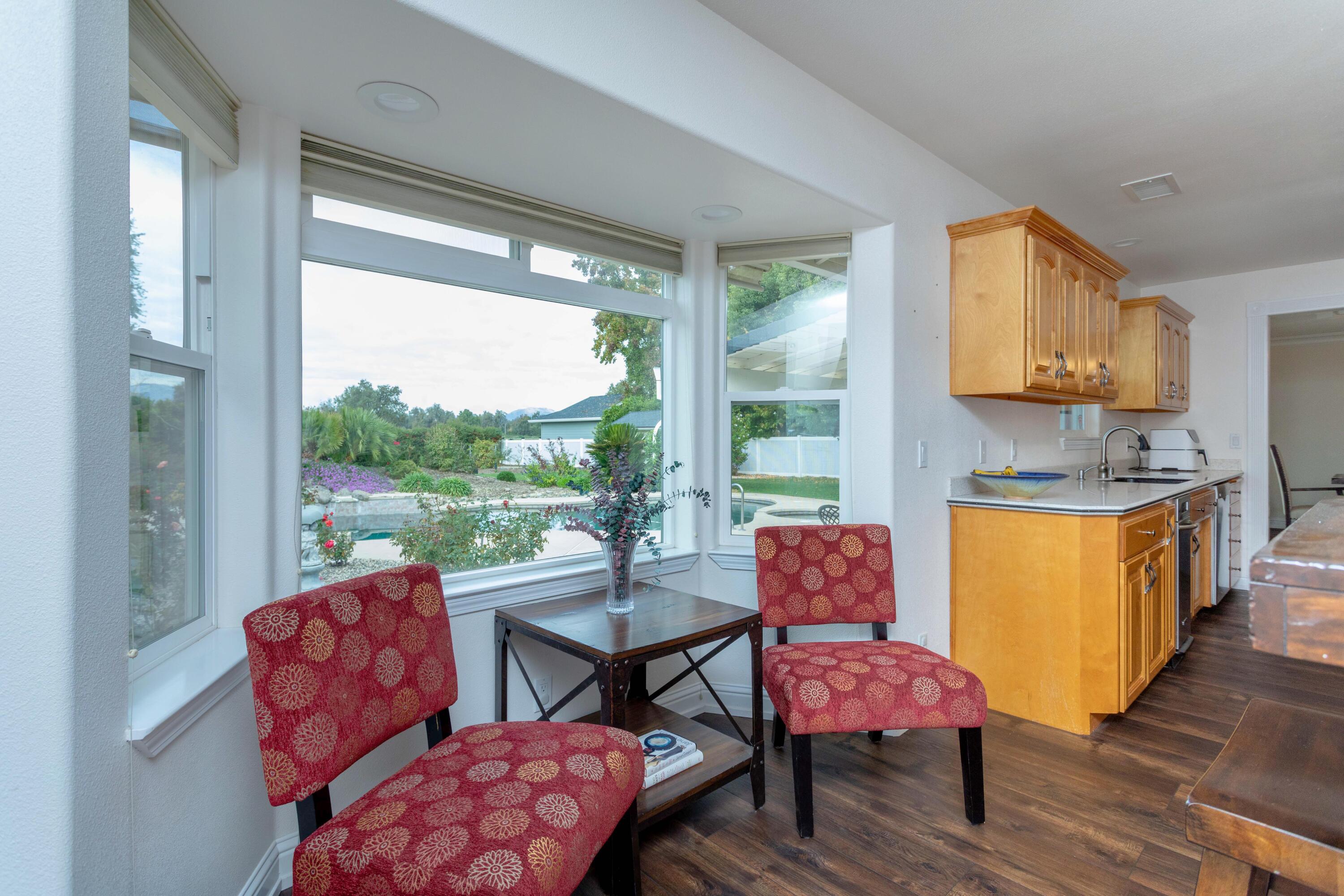 5956 Riverside Drive Redding, CA 96001 - Photo 24 of 54 a reading room with furniture and wooden floor