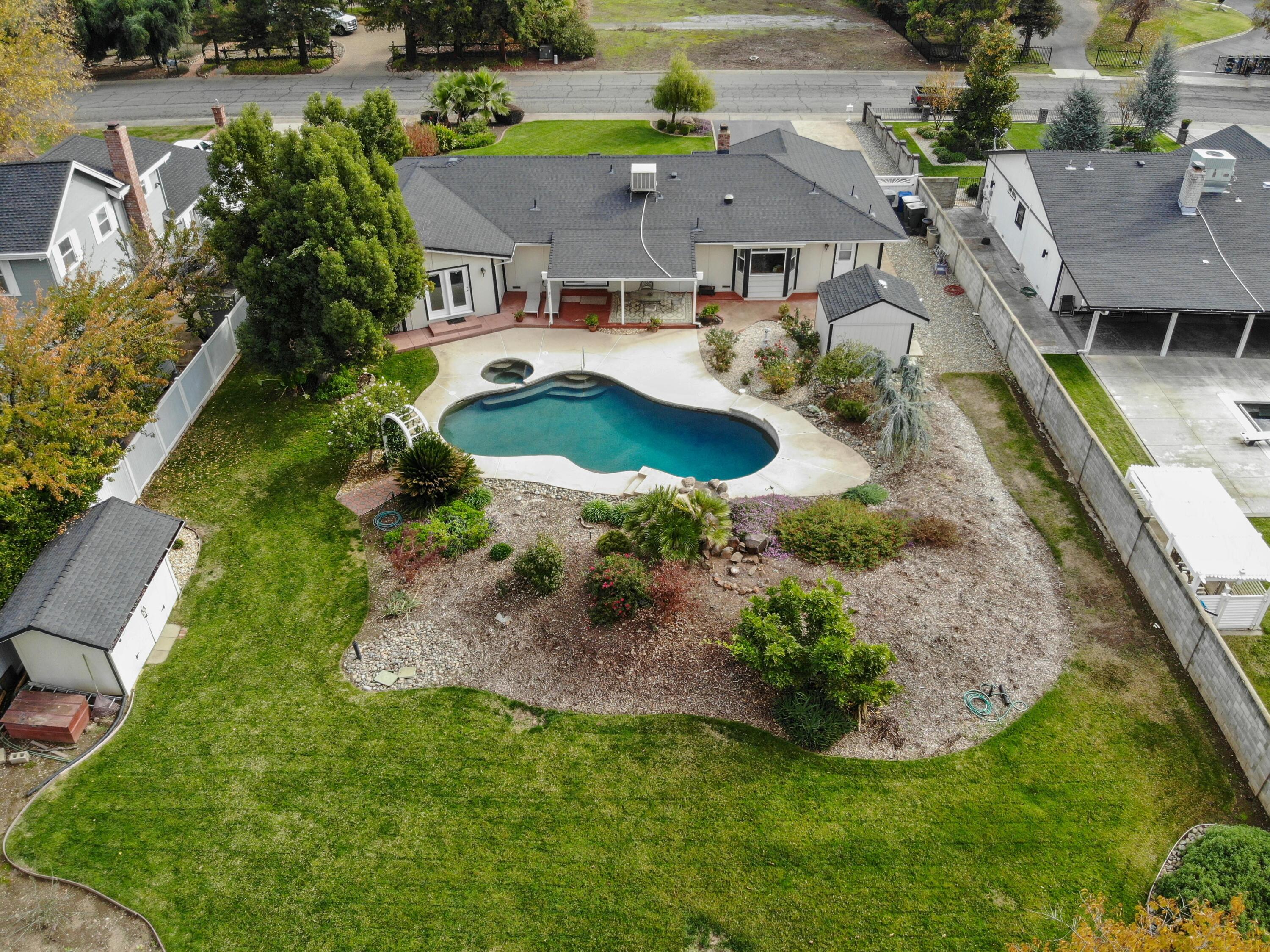 5956 Riverside Drive Redding, CA 96001 - Photo 4 of 54 an aerial view of residential houses with outdoor space and parking