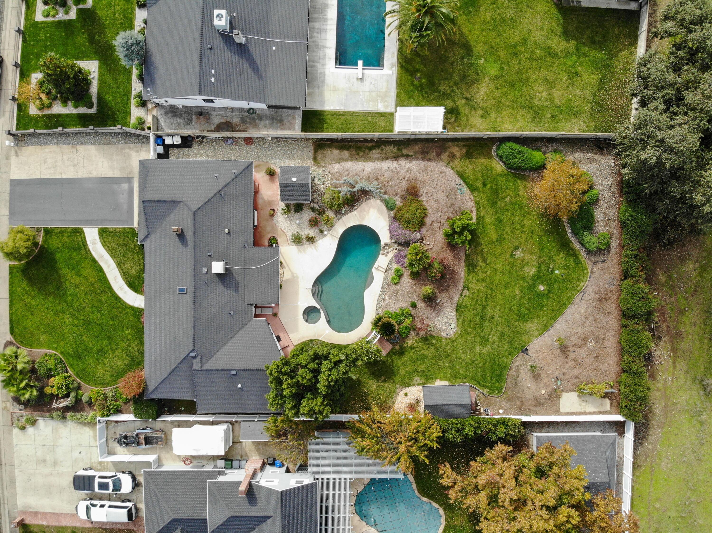 5956 Riverside Drive Redding, CA 96001 - Photo 54 of 54 an aerial view of a house with a garden