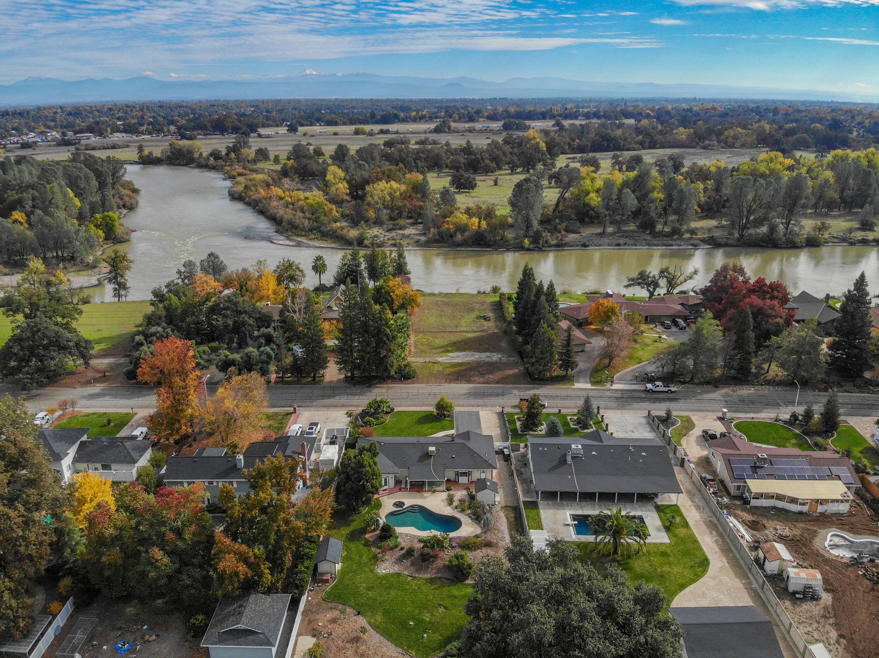5956 Riverside Drive Redding, CA 96001 - Photo 6 of 54 an aerial view of a house with outdoor space
