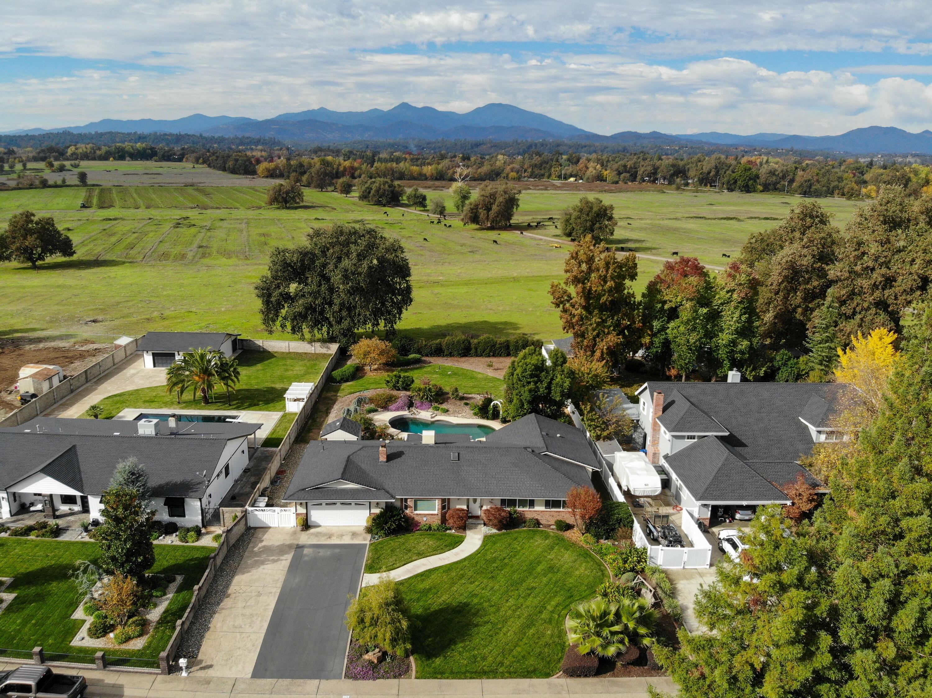 5956 Riverside Drive Redding, CA 96001 - Photo 7 of 54 an aerial view of residential houses with outdoor space