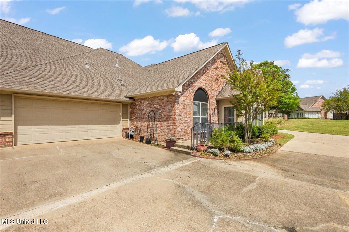 430 Independence Boulevard Flowood, MS 39232 - Photo 33 of 33 Side patio and garage