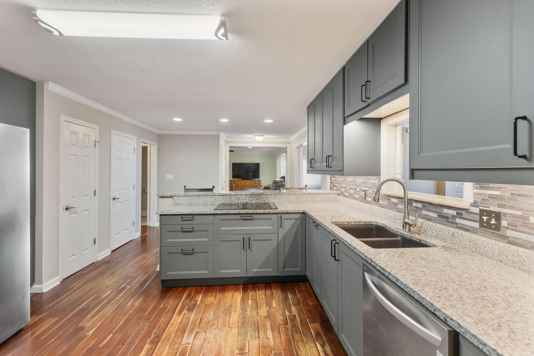 2415 Yellowood Court Cleveland, TN 37312 - Photo 18 of 83 a large kitchen with a lot of counter space and wooden floor