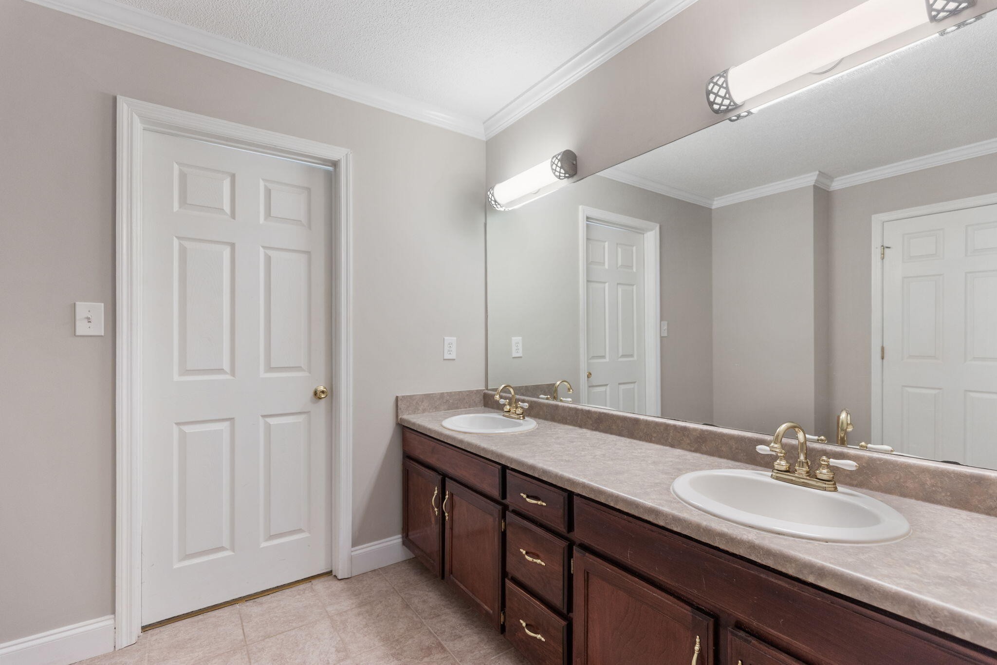 2415 Yellowood Court Cleveland, TN 37312 - Photo 39 of 83 a bathroom with a double vanity sink and a mirror