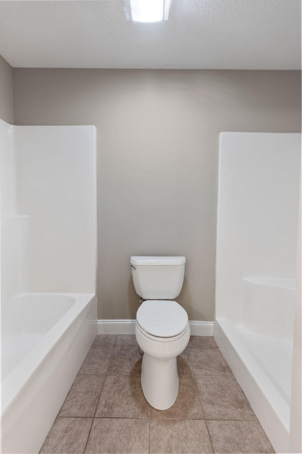 2415 Yellowood Court Cleveland, TN 37312 - Photo 40 of 83 a bathroom with a toilet and a bathtub