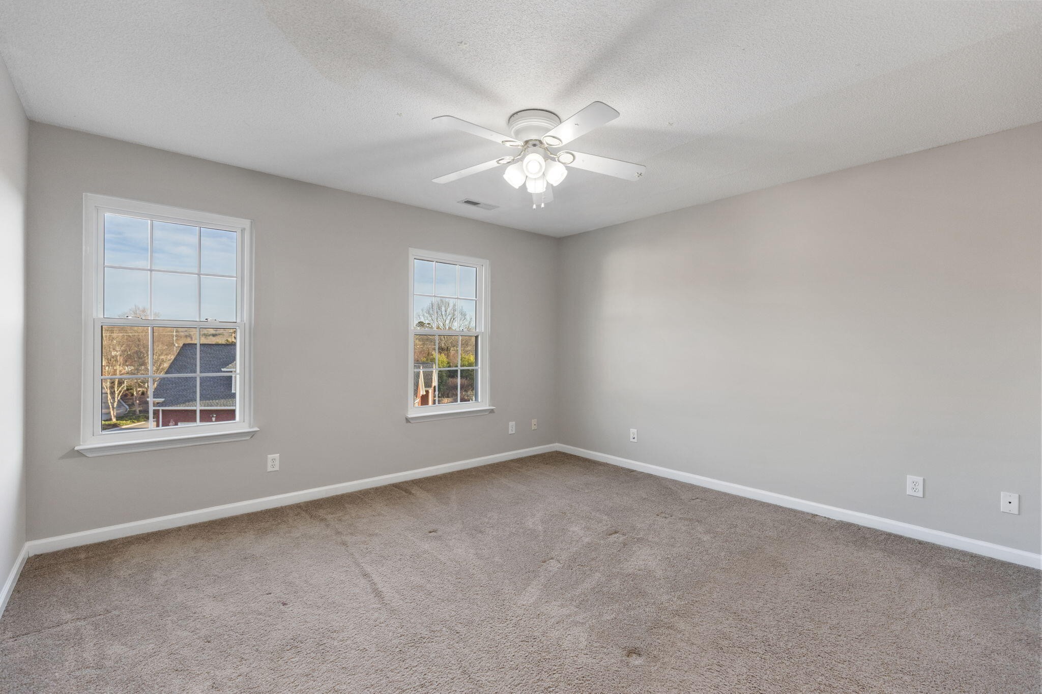 2415 Yellowood Court Cleveland, TN 37312 - Photo 45 of 83 an empty room with windows and fan