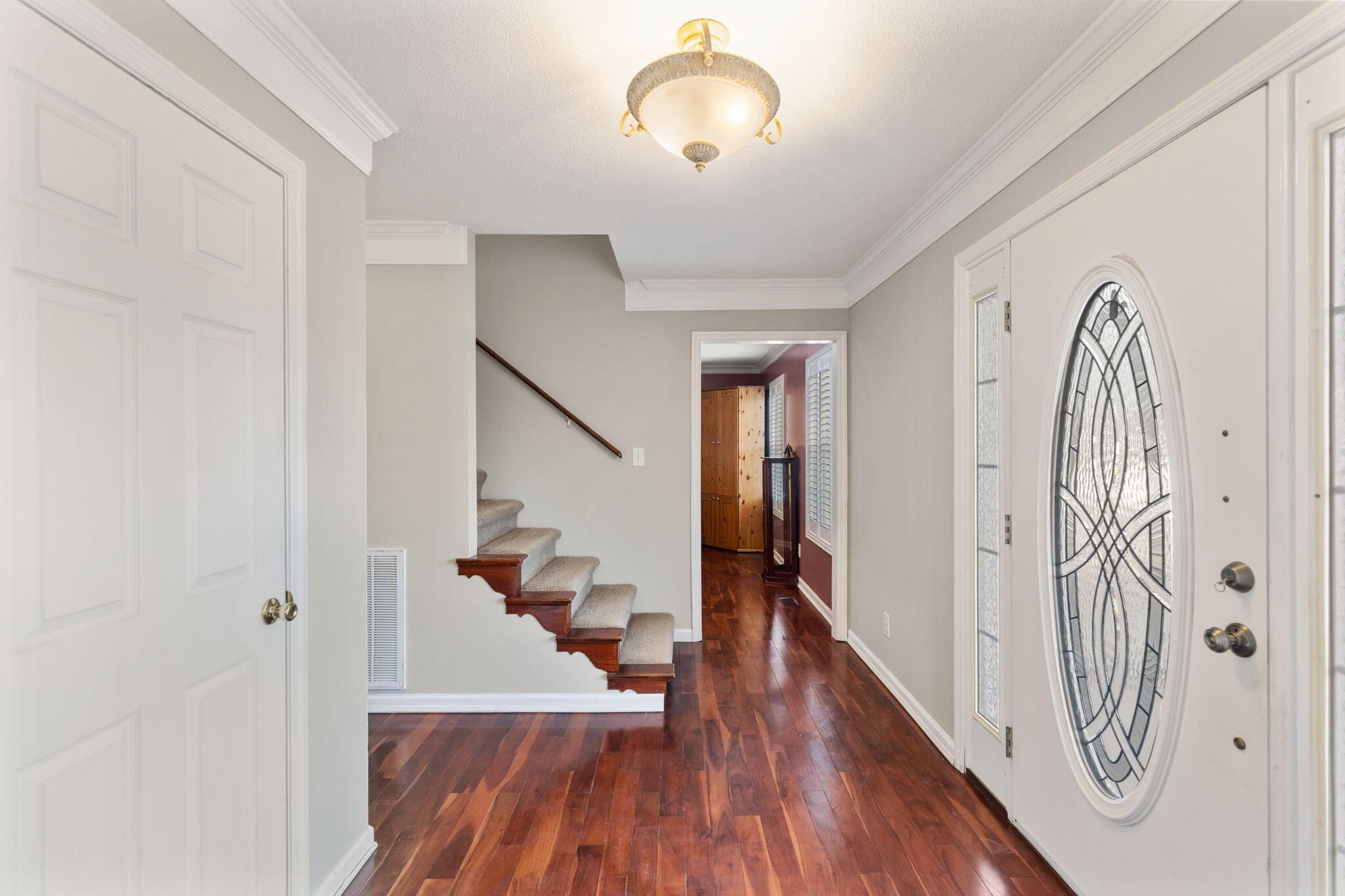2415 Yellowood Court Cleveland, TN 37312 - Photo 9 of 83 a view of a hallway with wooden floor and staircase