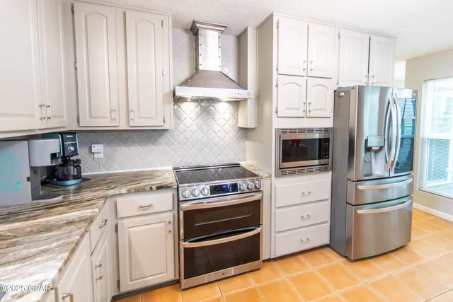 $699,900 | 215 Moonlight Bay Drive, Panama City Beach, FL 32407