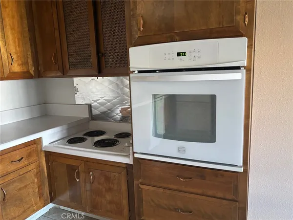 a kitchen with a stove and a microwave