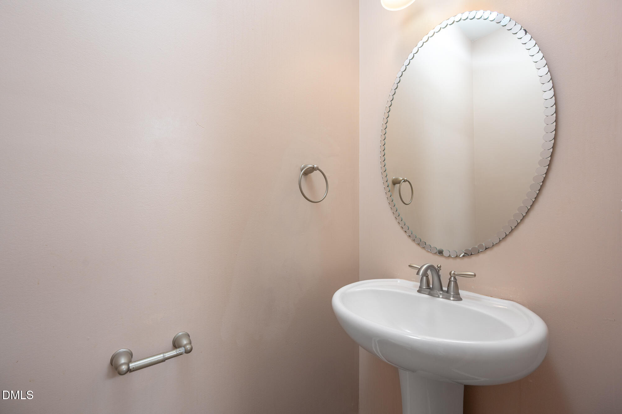 3548 Althorp Drive Raleigh, NC 27616 - Photo 7 of 56 a bathroom with a sink a mirror and vanity