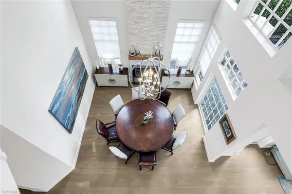 a view of living room with furniture and a chandelier
