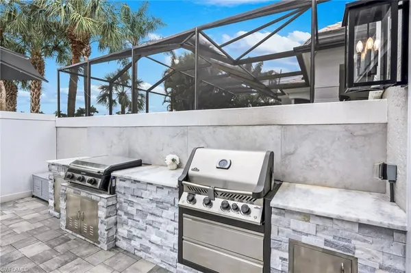 a stove top oven sitting inside of a kitchen